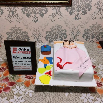 Couple in Bed Anniversary Cake