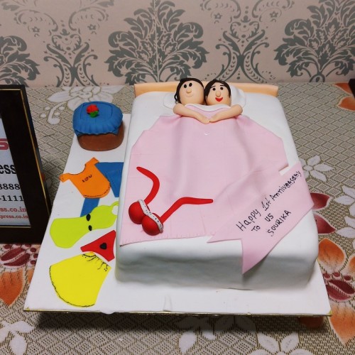 Couple in Bed Anniversary Cake Delivery in Delhi