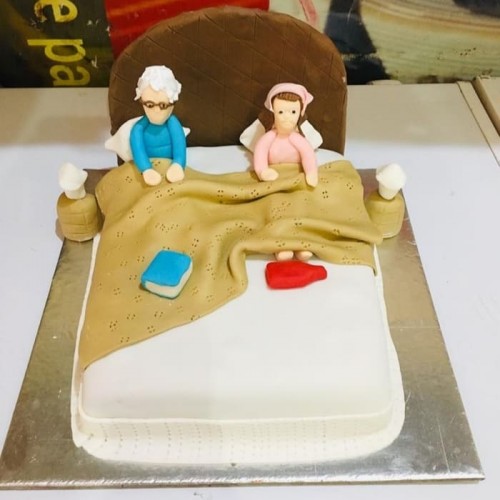 Old Parents in Bed Theme Cake Delivery in Delhi